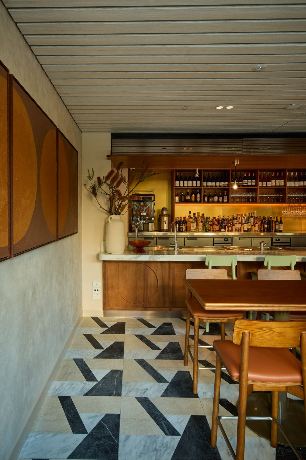 Bar fit-out with timber joinery and patterned stone floor