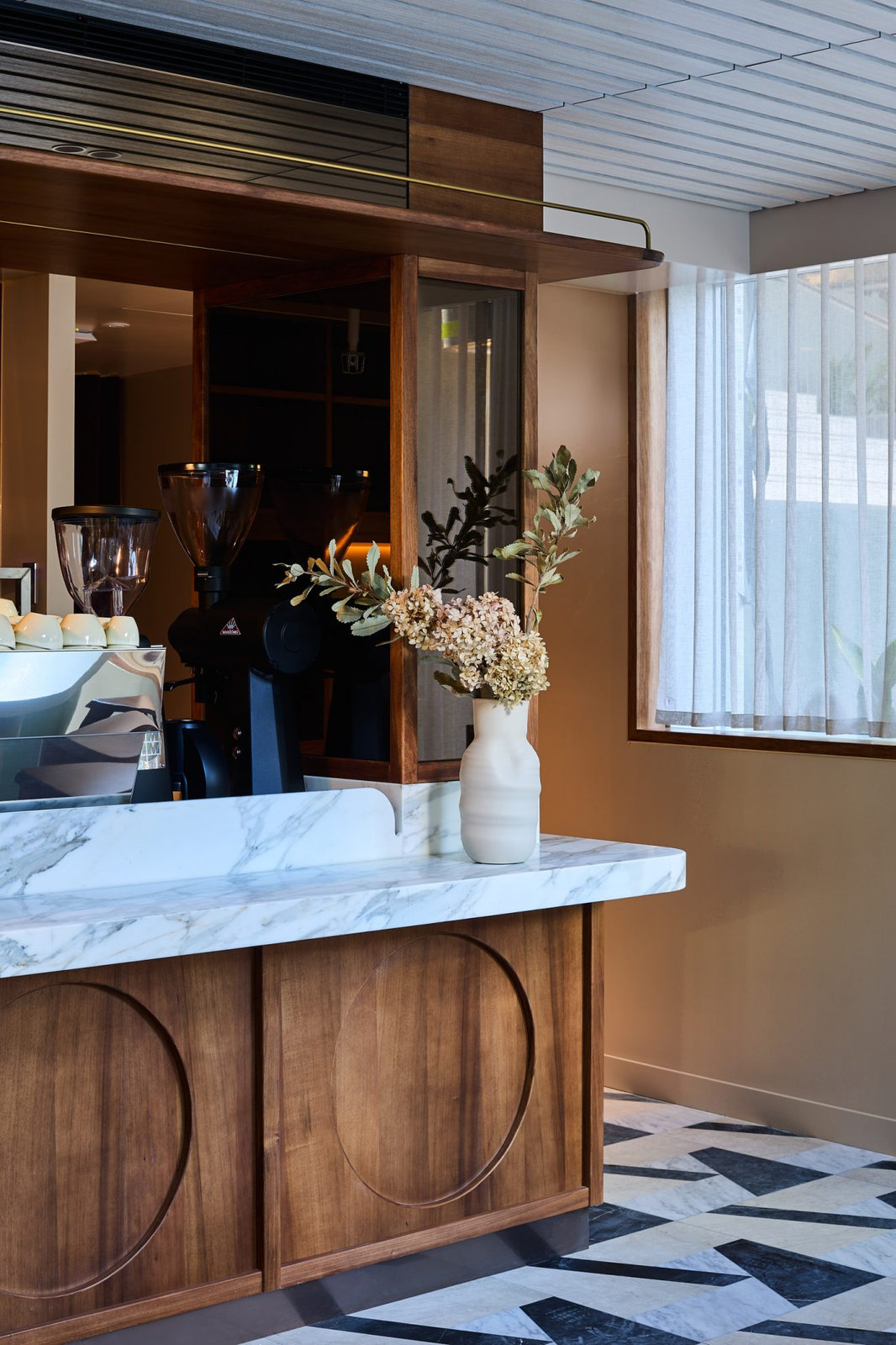 Walnut joinery coffee counter with marble benchtop