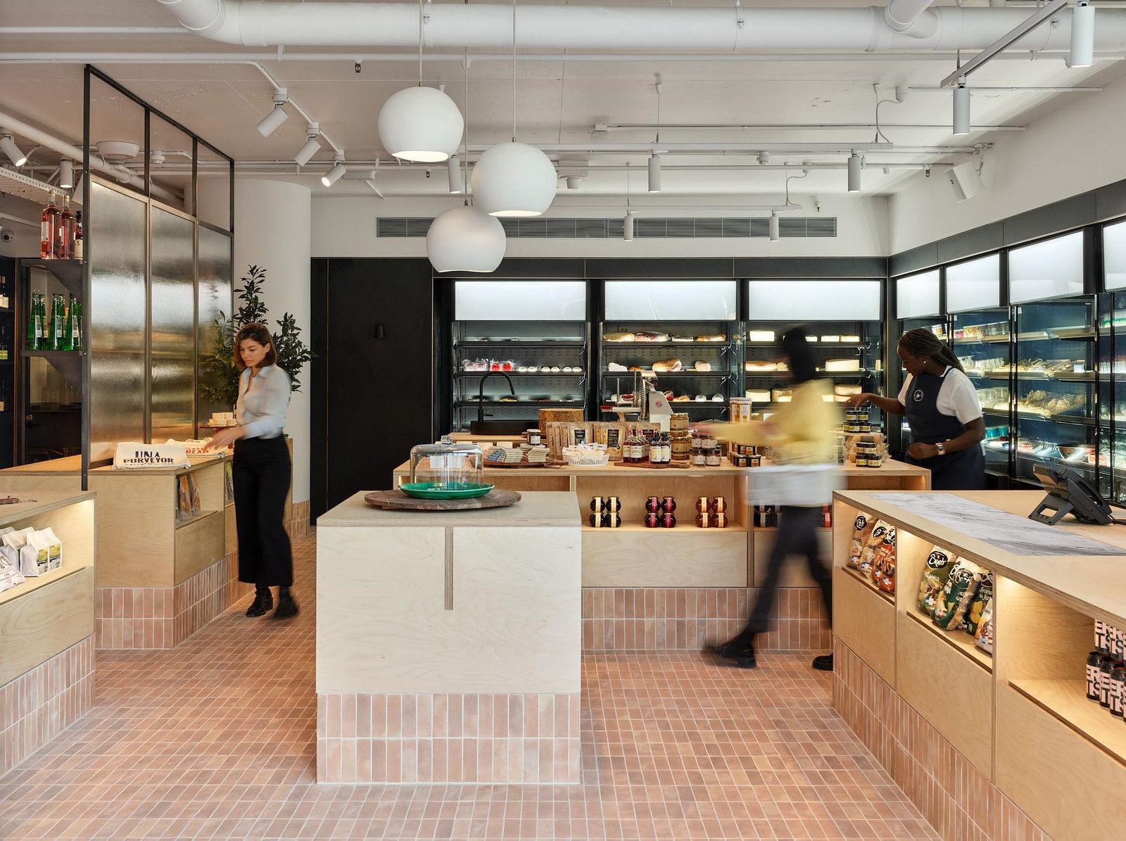 Artisan grocer interior with plywood joinery and display fridges